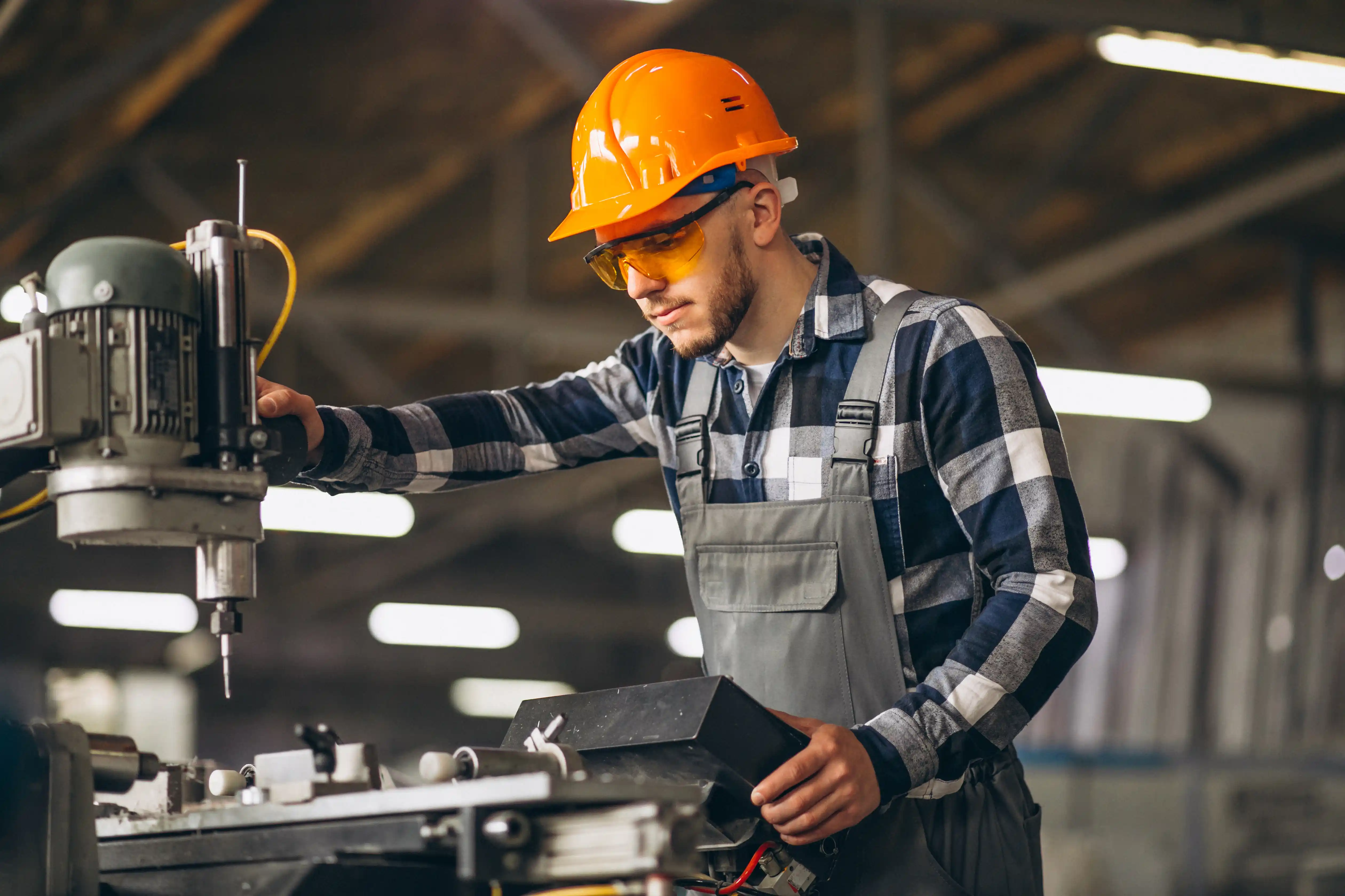 Worker operating a machine